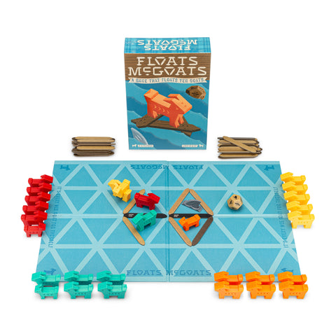 Floats McGoats game contents – a game board, sticks, goats, one die and the dreaded shark